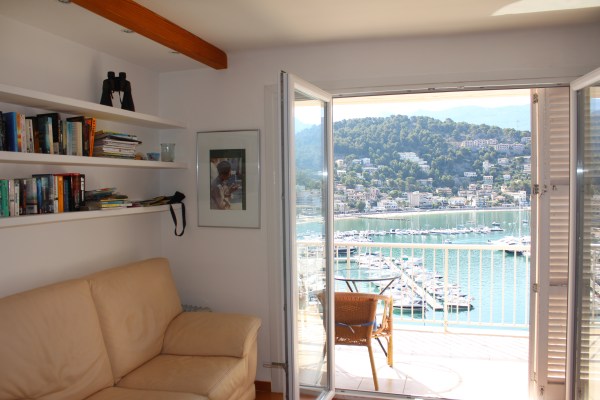 One copy of my book graces the book shelves at my apartment in the Port of Soller, with the best reading view of the Mediterranean, August 2013.