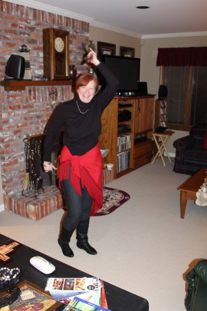 Demonstrating the use of castanets, a familiar sound with traditional Flamenco dancing.