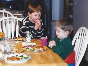 My sons praying at dinner, January 2000.